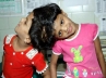 undivided twins Veena and Vani, Siamese twins, veena vani continue to be looked after by hospital, Siam