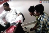 TRS, youth beaten, jagadish reddy confirms the man in the video is not a trs mla, Youth beaten