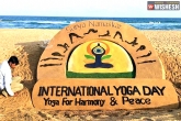 International Yoga Day, Sand sculptures, sand artists create sand art on puri beach, Yoga