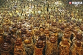 weird news, Buddha statues, chinese man carves 9 200 buddha statues from dead trees, Buddha statues
