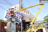 illegal hoardings Hyderabad, GHMC officials, 20 000 illegal hoardings removed in hyderabad, Illegal