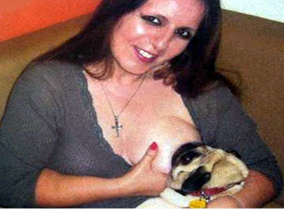 Woman breastfeeds dog