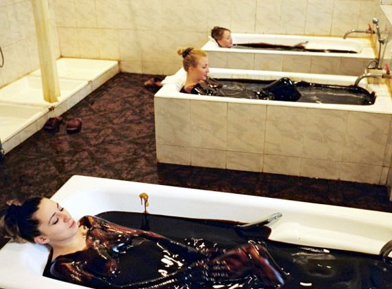 Crude oil bathing woman, petro-dollars , sky scrappers and corruption ; The Azerbaijan story